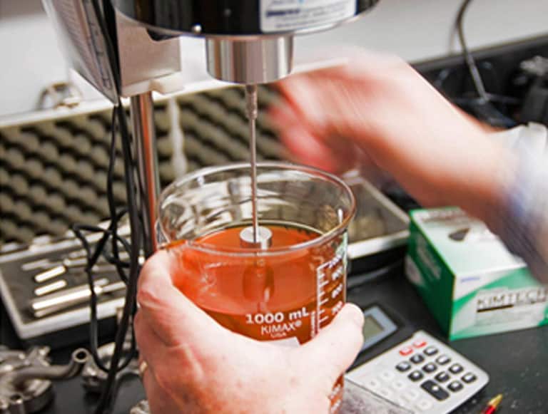 Scientist creating a formula in a lab.