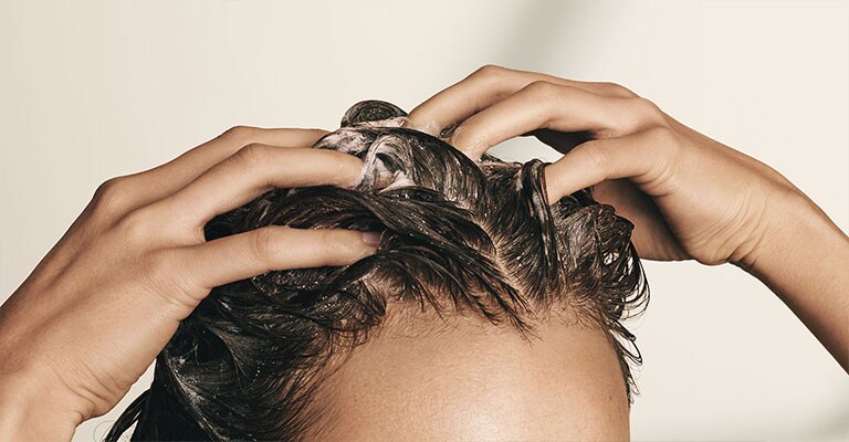 Step 2: before shampoo, pre-cleanse your scalp with pramasana purifying scalp cleanser.