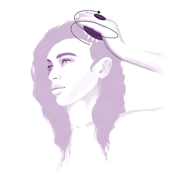 Step 2: Using the invati advanced scalp massager, work in circular motions from the hair line to the crown of the head. 